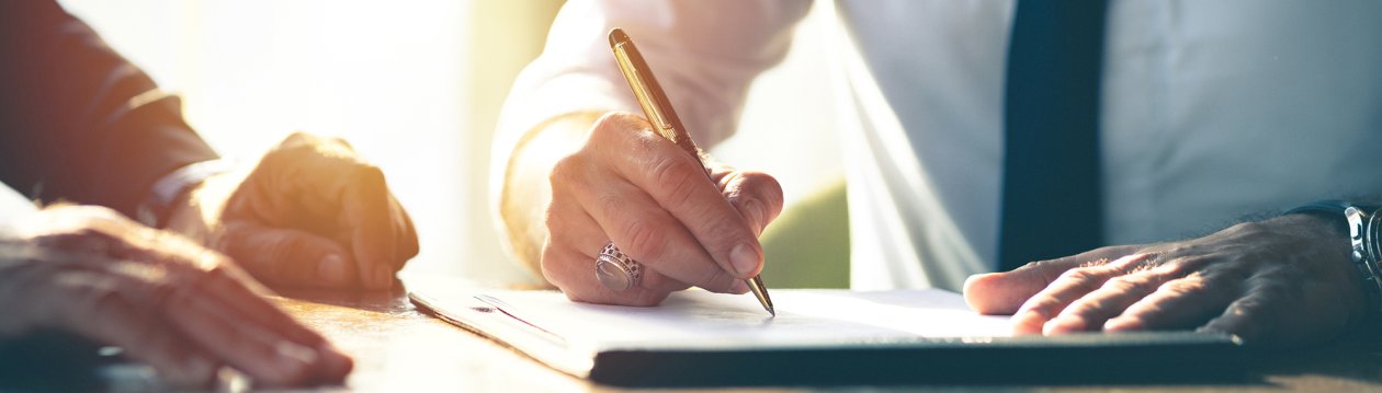 Person is writing something on a sheet of paper. Person is writing something on a sheet of paper.
