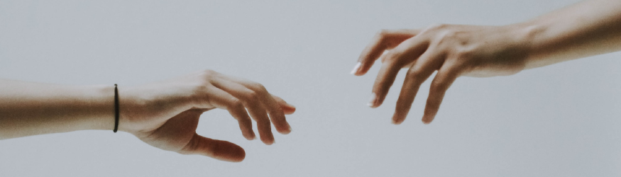 Two hands grasping each other. [1]