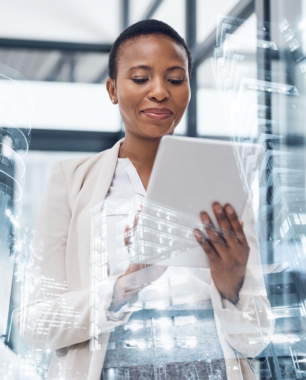 A short-haired woman is holding a tablet.