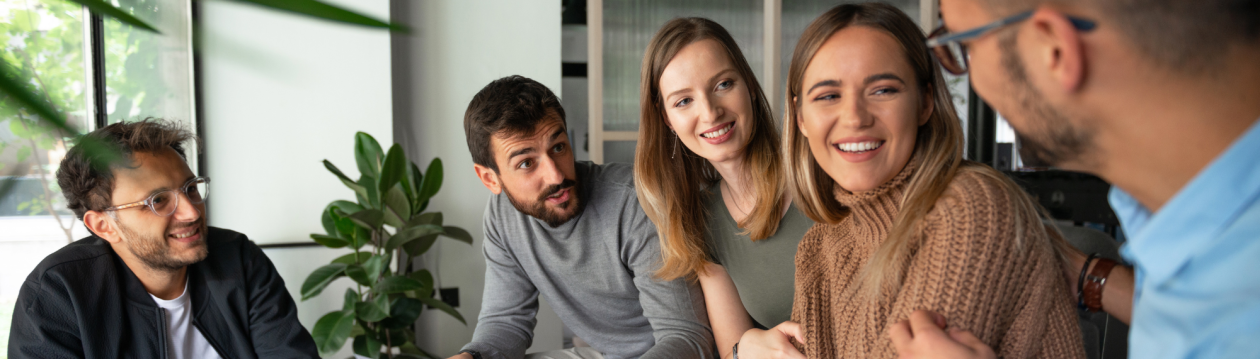 A group of people sitting together and talking. A group of people sitting together and talking.