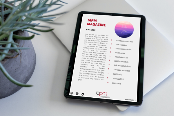 Tablet lying next to a plant on a table, showing the cover of IAPM Magazine June. Tablet lying next to a plant on a table, showing the cover of IAPM Magazine June.