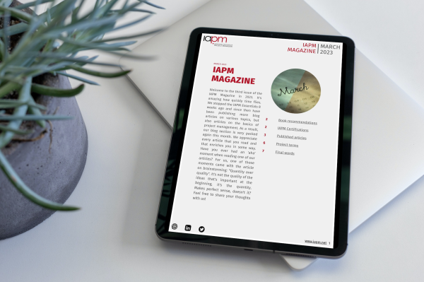 Tablet lying next to a plant on a table, showing the cover of IAPM Magazine March. Tablet lying next to a plant on a table, showing the cover of IAPM Magazine March.