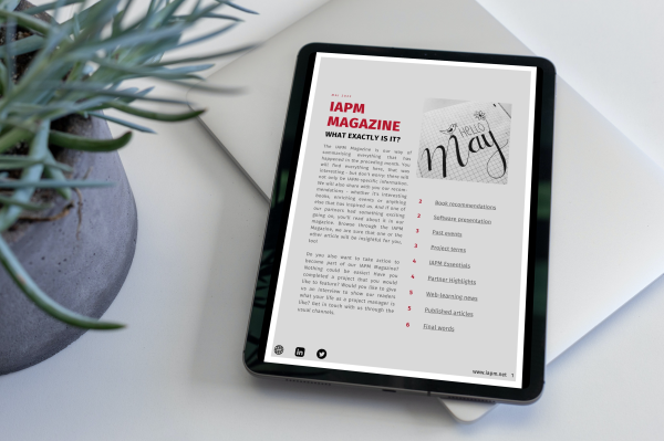 Tablet lying next to a plant on a table, showing the cover of IAPM Magazine May. Tablet lying next to a plant on a table, showing the cover of IAPM Magazine May.