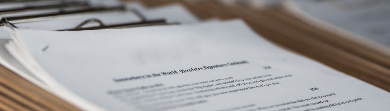 Oblique view of papers with text on a table. Oblique view of papers with text on a table.