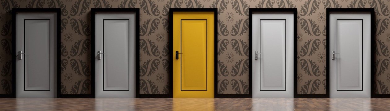 Five doors, the door in the middle is yellow, all others white. Five doors, the door in the middle is yellow, all others white.