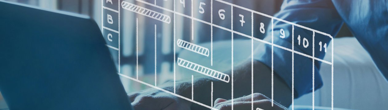 Resource planning - Hands are typing on a laptop. A project plan drawn with white lines hovers above the laptop. Resource planning - Hands are typing on a laptop. A project plan drawn with white lines hovers above the laptop.