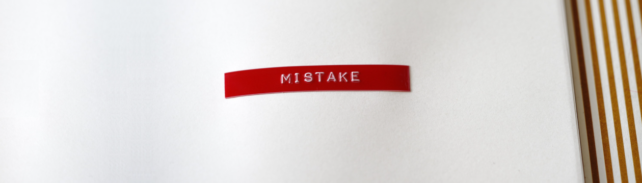 A sticker that says "mistake."