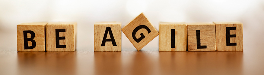 Several dice form the inscription BE AGILE. Several dice form the inscription BE AGILE.