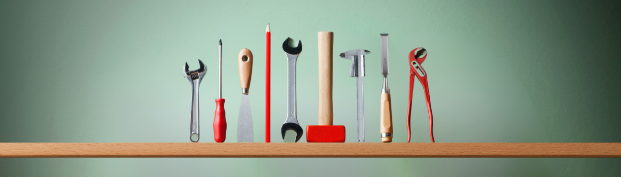 Several tools are on a shelf. Several tools are on a shelf.
