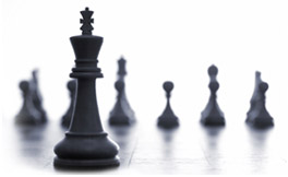 Several black chess pieces.